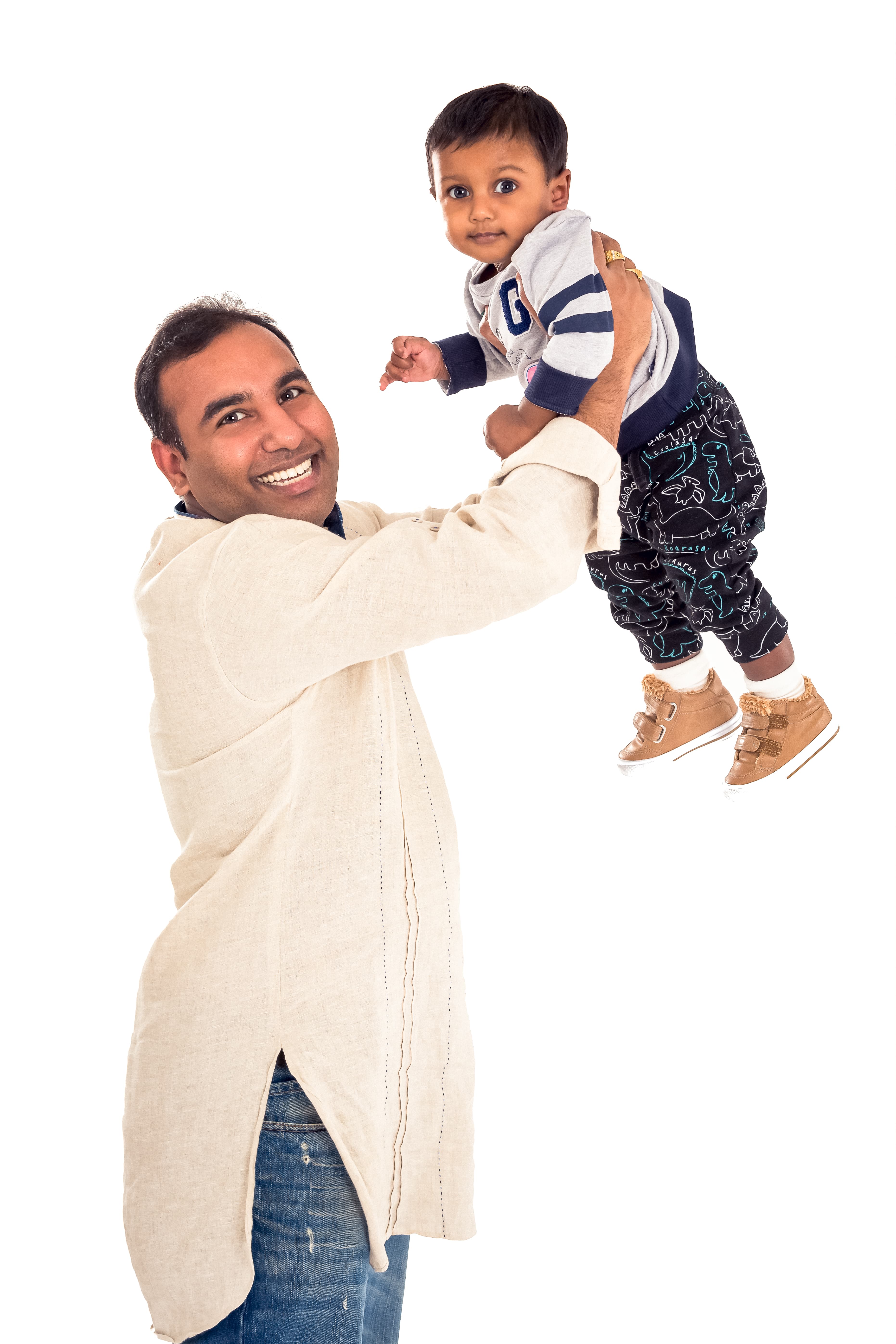 Father lifting baby daughter