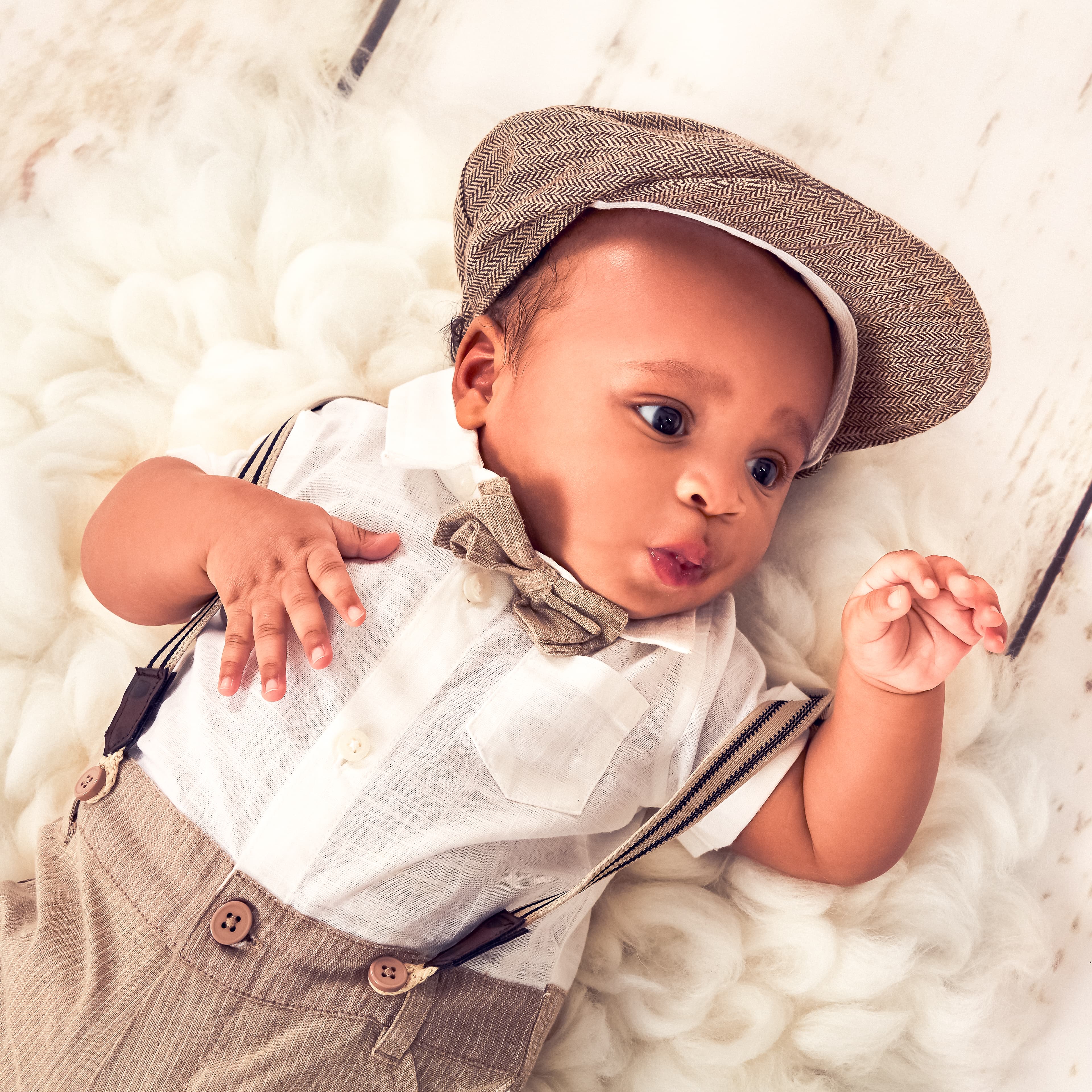 Newborn baby boy in vintage outfit